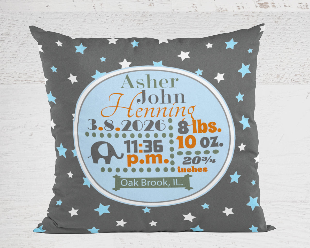 Personalized pillow with baby's birth details on a gray background with star patterns