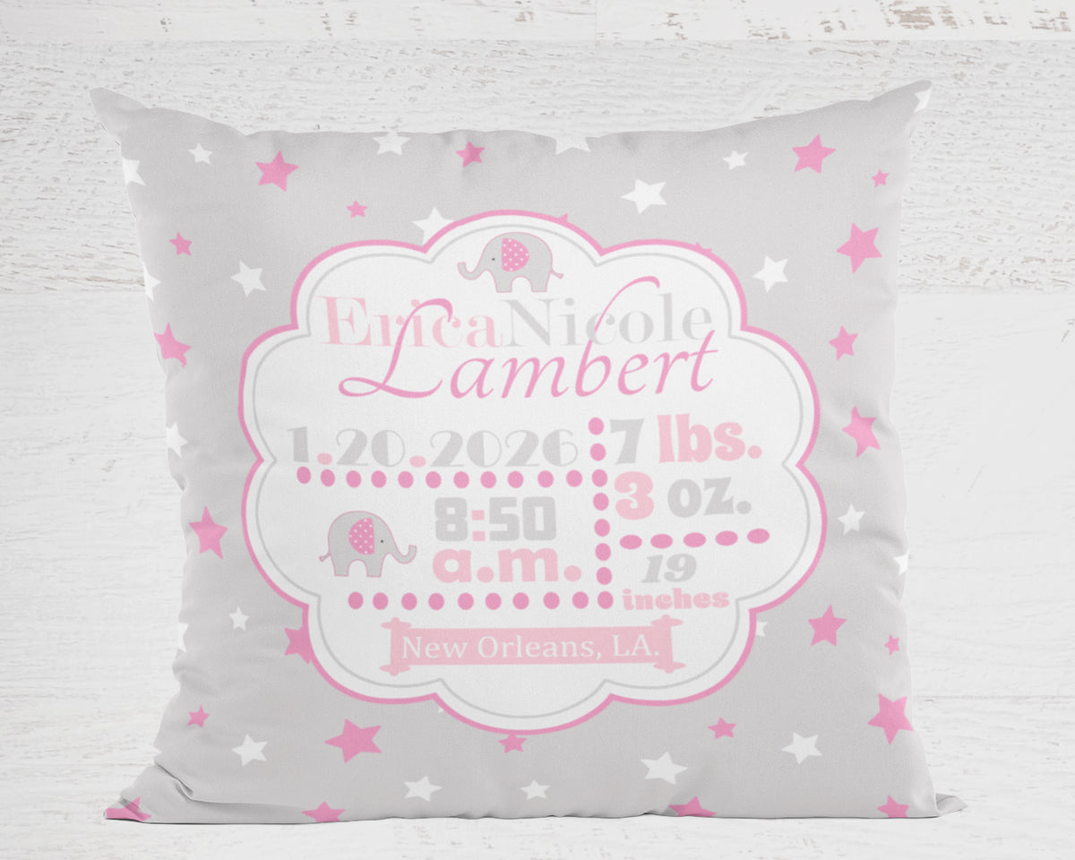 Personalized baby pillow with name, birth details, and star pattern on a gray background