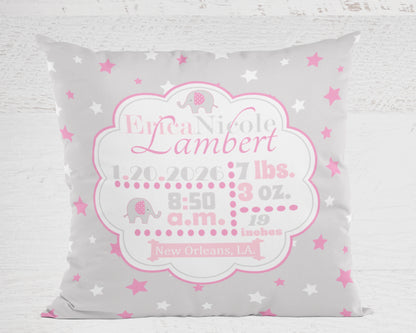 Personalized baby pillow with name, birth details, and star pattern on a gray background