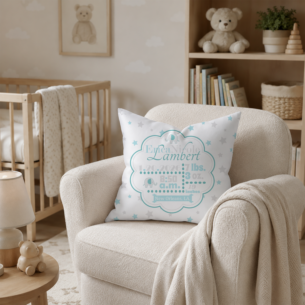 Nursery room with a personalized pillow in spearmint details on an armchair, teddy bear, and books in the background.