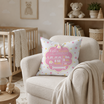 Baby nursery with a personalized pillow in pink and yellow on a chair, crib, and shelves with toys and books.