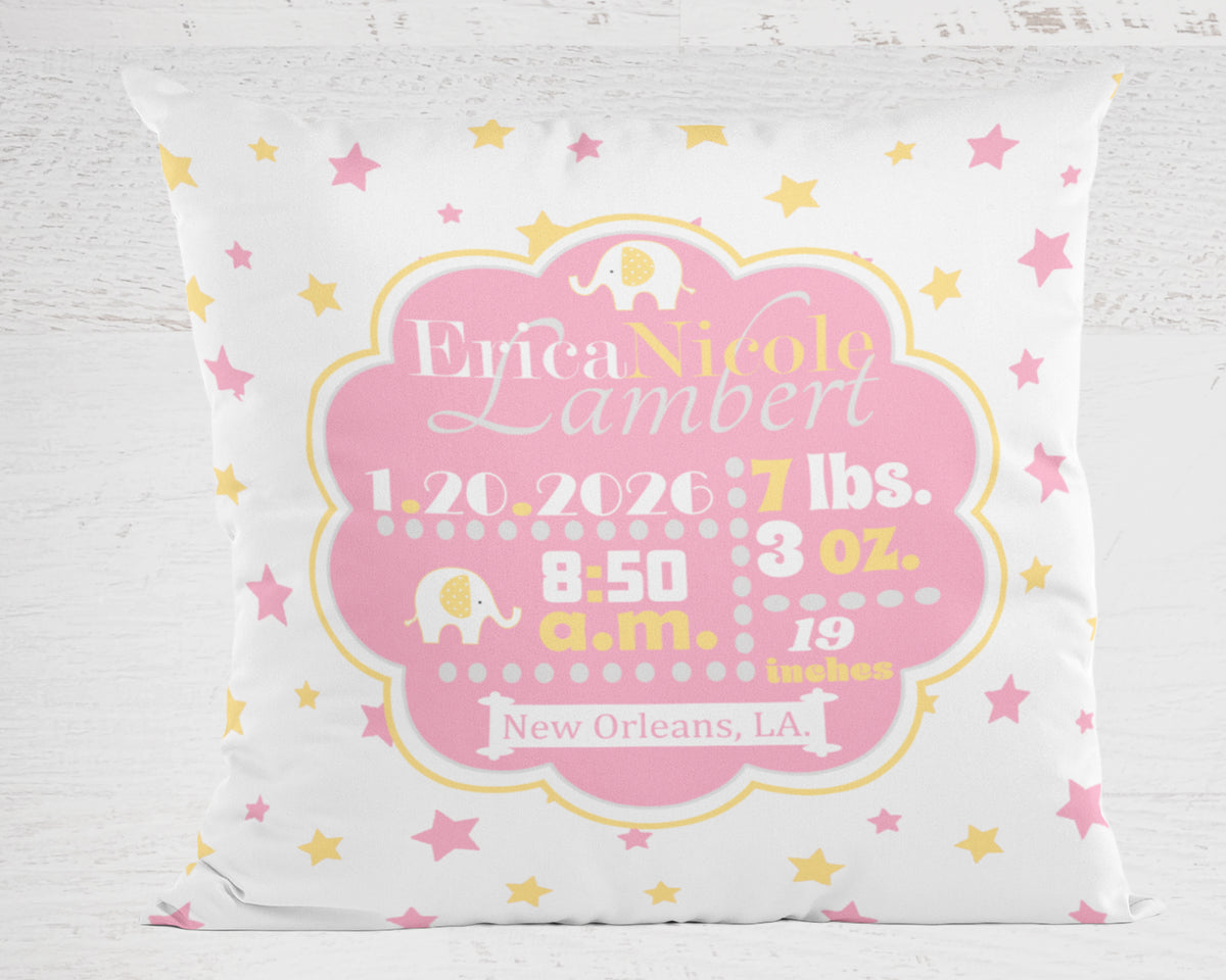 Personalized baby pillow in pink and yellow with name, birth details, and baby elephant design on a white background.
