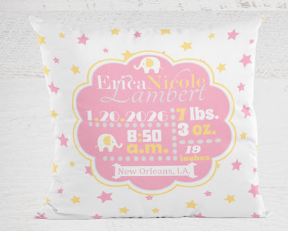 Personalized baby pillow in pink and yellow with name, birth details, and baby elephant design on a white background.