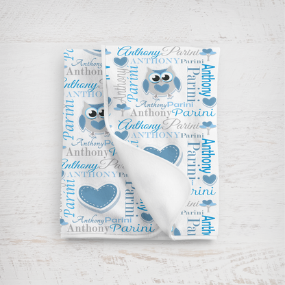 Baby blanket with owl design and personalized text on a white background