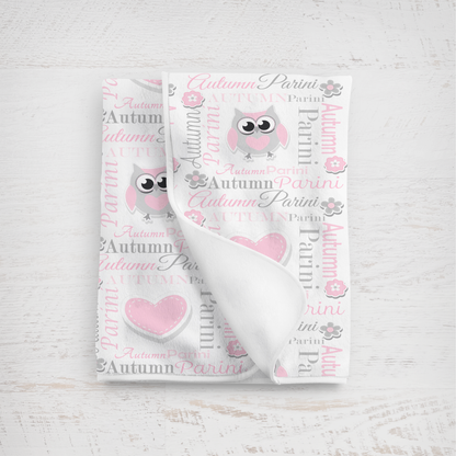Baby blanket in pink and gray lettering with owl design on a white background