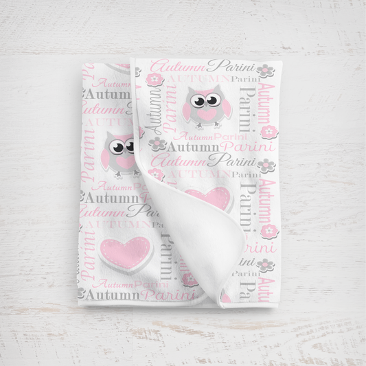 Baby blanket in pink and gray lettering with owl design on a white background