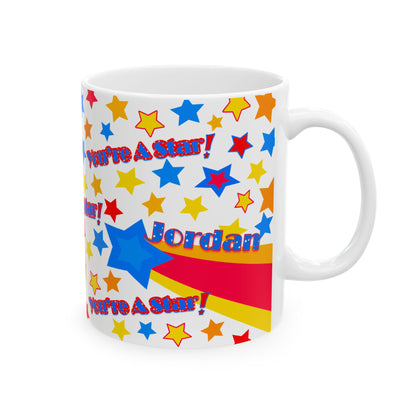 White mug with colorful star pattern and text on a white background